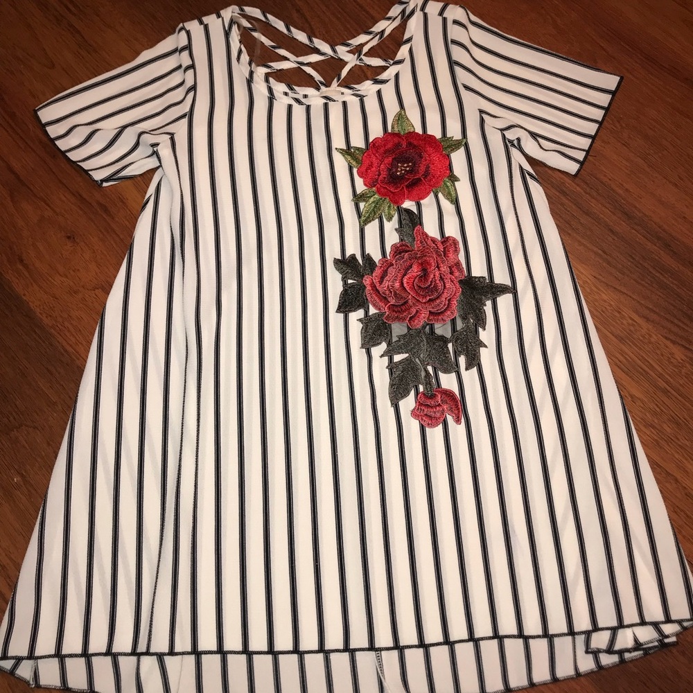 Striped boutique top with floral accents